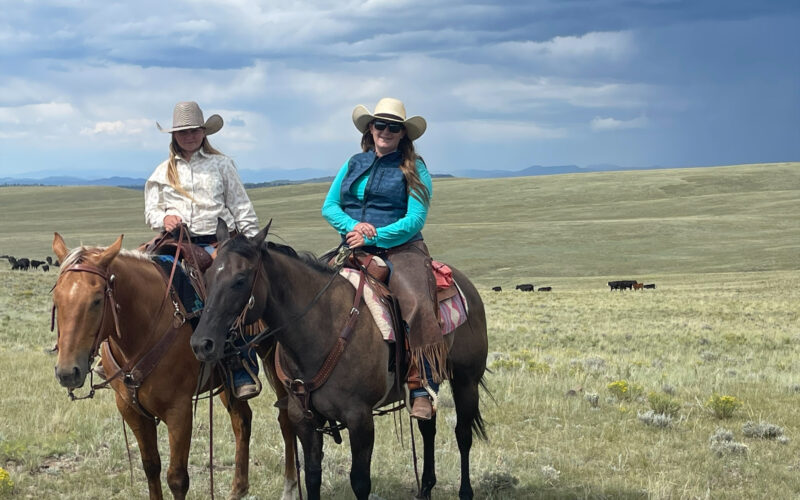 Agent Sierra Goering and daughter on horseback